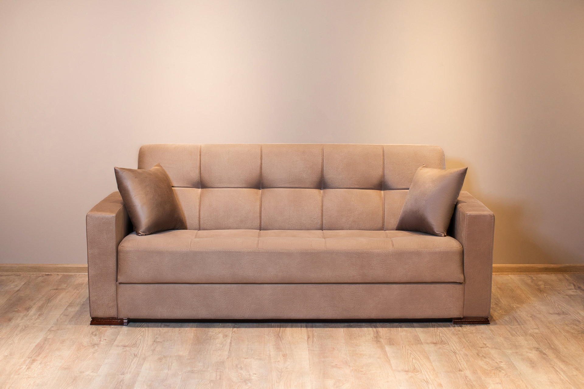 closeup-shot-of-a-beige-sofa-with-two-pillows-in-a-2023-11-27-05-05-21-utc